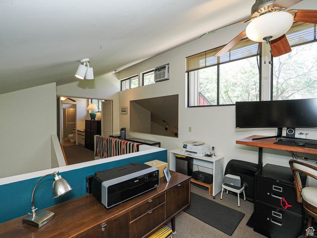 Office space with ceiling fan, an AC wall unit, and lofted ceiling | Image 45