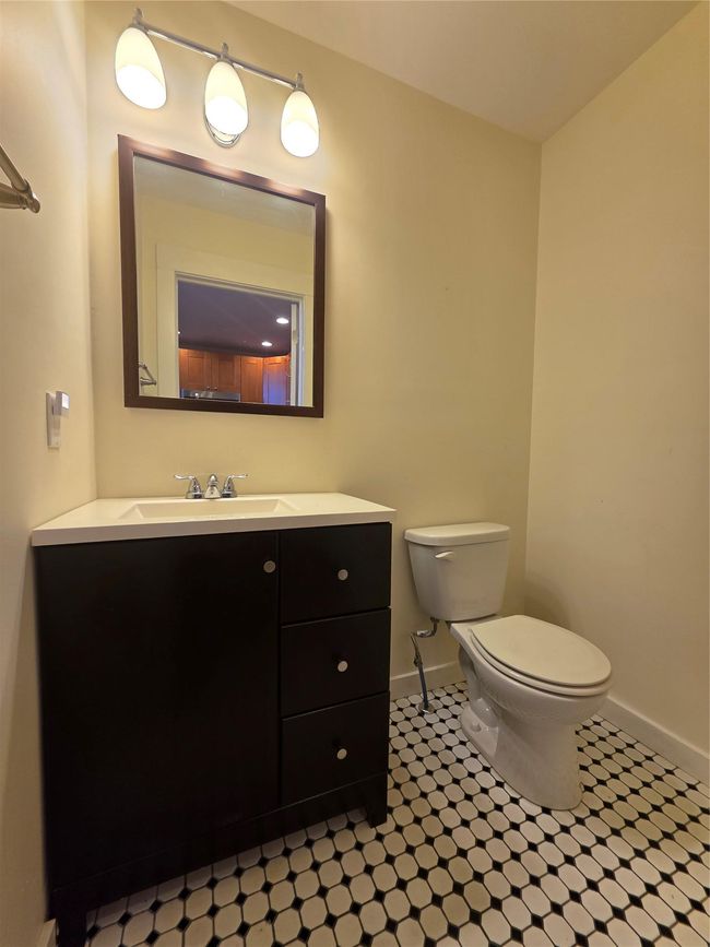 Bathroom featuring toilet, vanity, and baseboards | Image 13