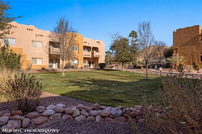 View of property's community with a lawn | Image 47