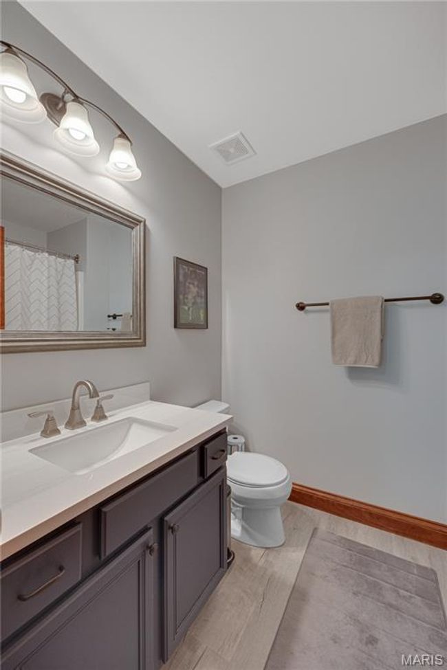 Bathroom featuring vanity and wood finished floors | Image 39
