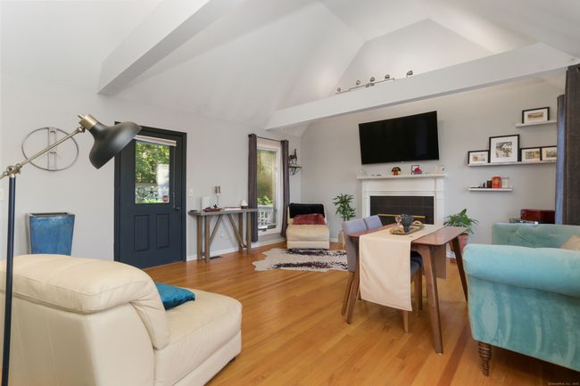 There's a door to the deck from the living room, great for indoor/outdoor entertaining and everyday living. | Image 6