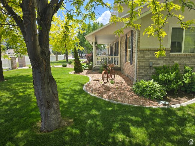 View of green lawn with a porch | Image 81