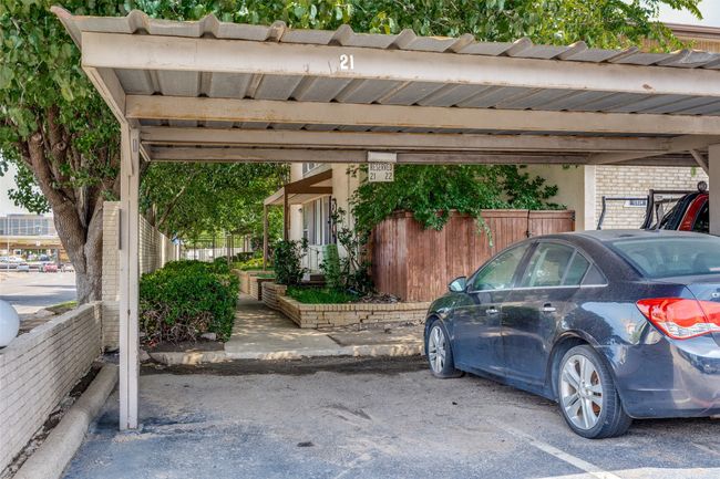 View of covered parking spot. Condo is straight through to the end | Image 23