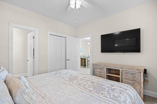 This bedroom has access to the bathroom | Image 8