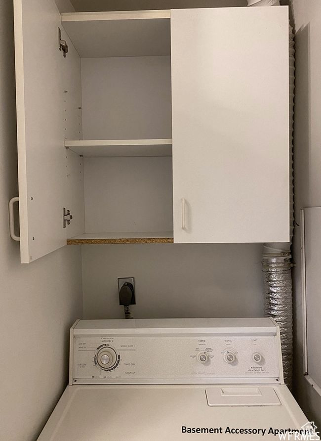 Laundry room featuring cabinet space and washer / dryer | Image 35