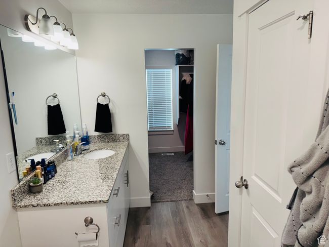 Bathroom featuring wood finished floors and vanity | Image 13