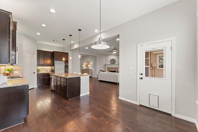 Adjoining breakfast room with built-in pet entry perfect for everyday living and pet-friendly convenience | Image 17