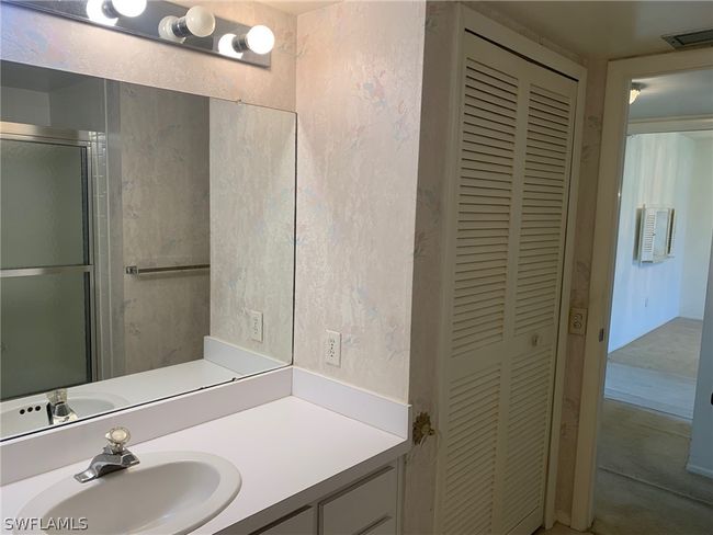Bathroom featuring vanity and linen closet | Image 20