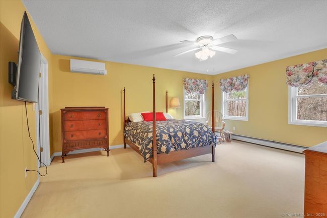 Primary en-suite bedroom with walk-in closet, full bathroom, and dressing room or second walk-in closet. | Image 14