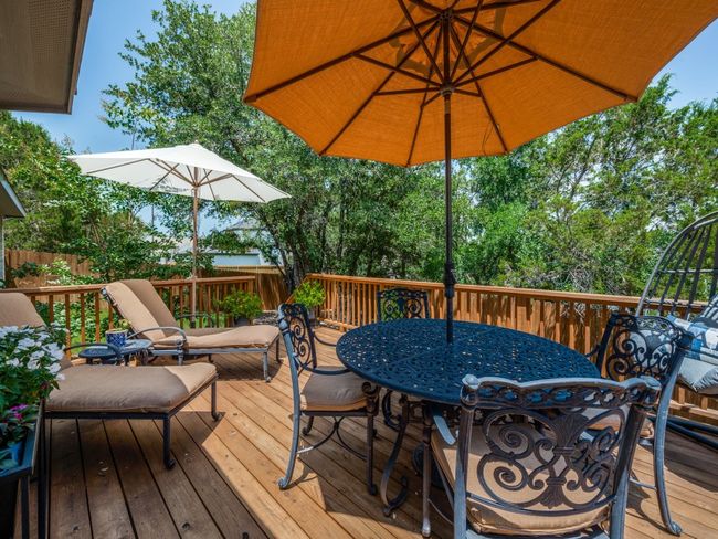 Wooden terrace featuring outdoor dining area | Image 24
