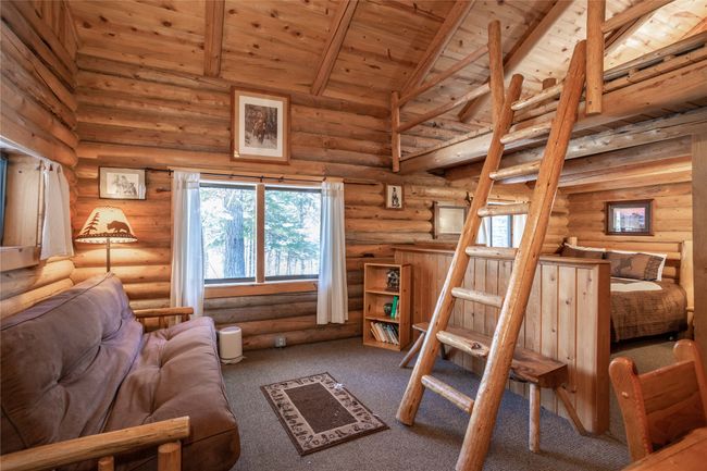 Living room, loft access & looking towards main level bedroom area | Image 98