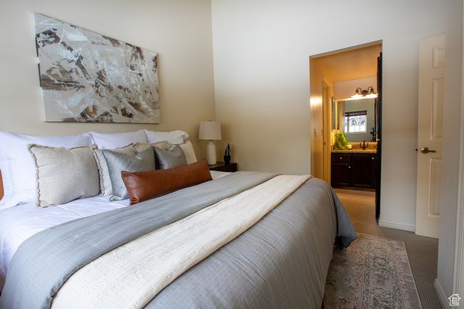 Bedroom with carpet floors, a sink, and ensuite bathroom | Image 15