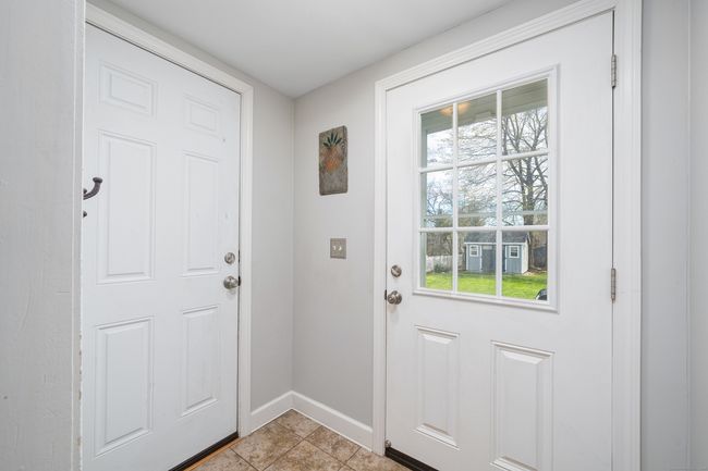 New mudroom leading to garage and back yard, perfect for shoes and boots | Image 15