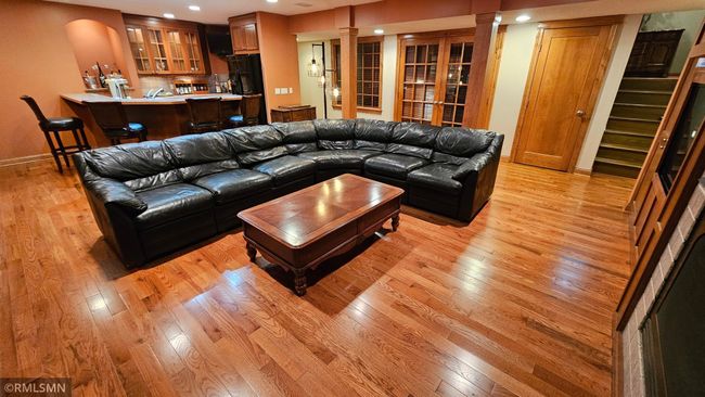 Lower-level recreation room with new solid oak hardwood floors | Image 43