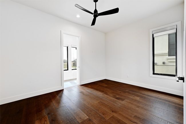 Spare room featuring dark wood finished floors, recessed lighting, a ceiling fan, and baseboards | Image 27