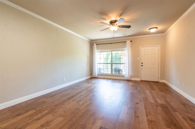 Pretty outdoor views, and natural light, from the large living room window. | Image 4