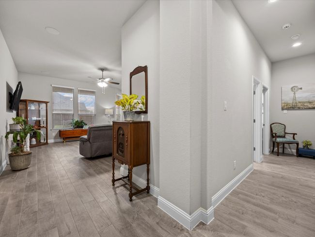 Hall featuring wood finished floors and recessed lighting | Image 12