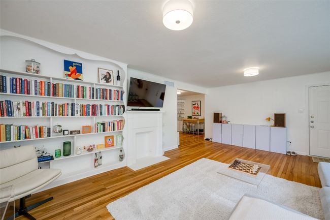 Sitting room with wood finished floors | Image 18