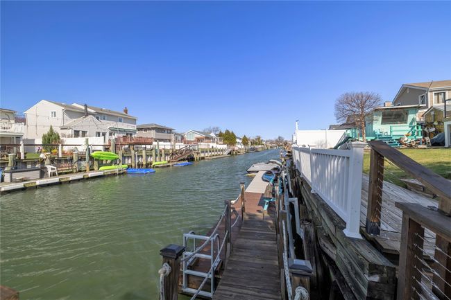 View of dock with a residential view and a water view | Image 34