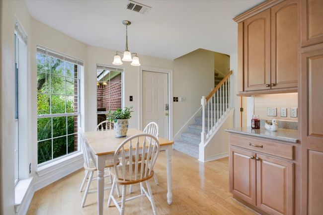 The open layout and cozy breakfast area make this kitchen as functional as it is beautiful. | Image 9