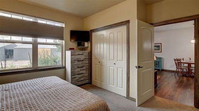 Primary Bedroom suite with two closets, one a walk-in, neutral shades on the wall and carpet. Top down bottom up shades for privacy. | Image 21