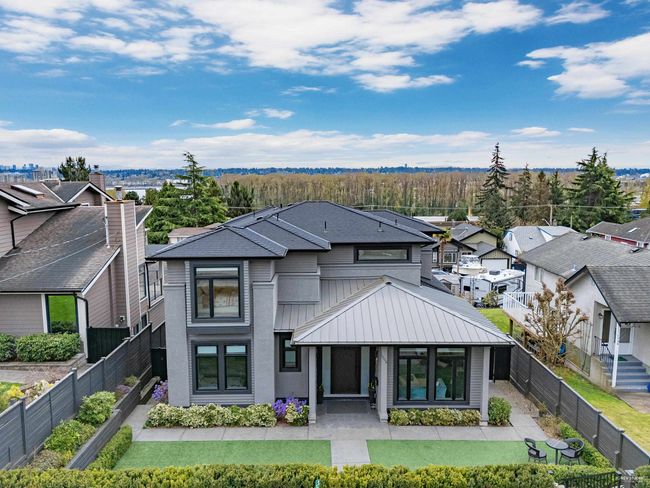 View of front of house with a residential view, fence private yard, a standing seam roof, and metal roof | Image 35