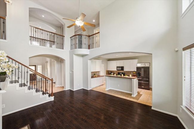View from the living room towards the kitchen and 2nd floor. The house and kitchen cabinets have been painted in May 2025. | Image 17