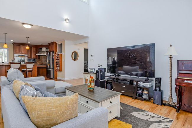 Living area featuring light wood-type flooring and baseboards | Image 8