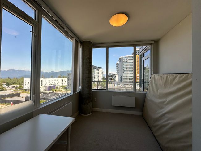 Unfurnished sunroom with a mountain view and a city view | Image 11