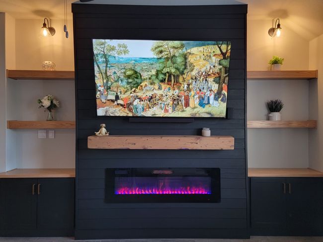 Room details with built in shelves and a large fireplace | Image 19