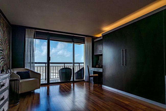 Murphy bed tucked away neatly against the wall creating a spacious and versatile area. | Image 15