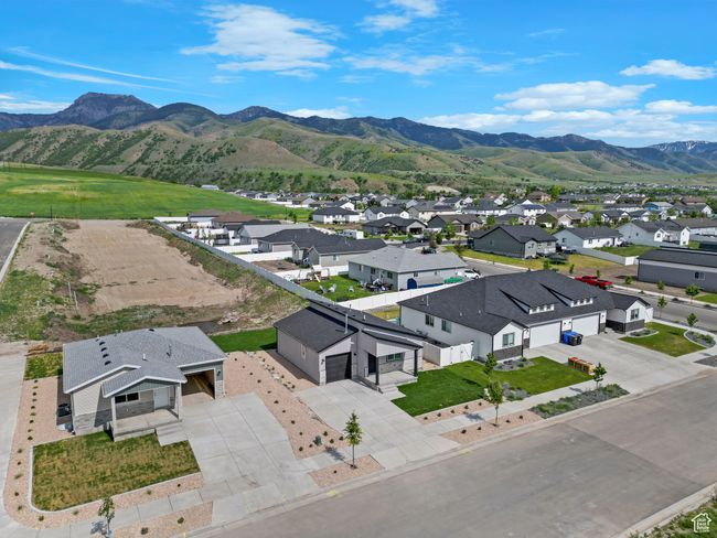 Aerial view of residential area with mountains | Image 5