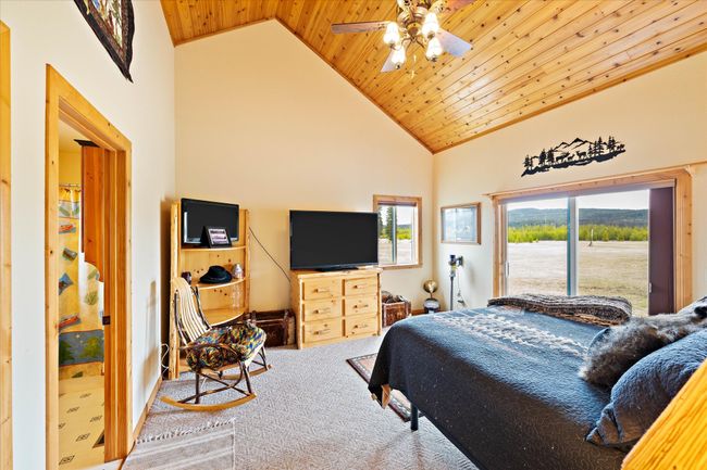 Main Cabin - Primary bedroom on main level | Image 34