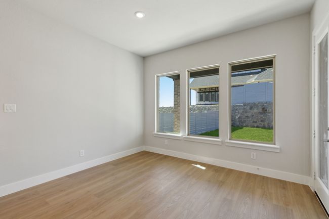 Empty room featuring light wood-style floors and recessed lighting | Image 17