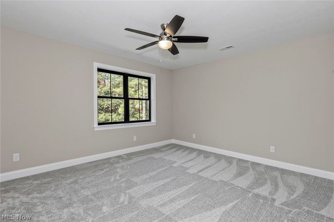 Unfurnished room featuring carpet and ceiling fan | Image 47
