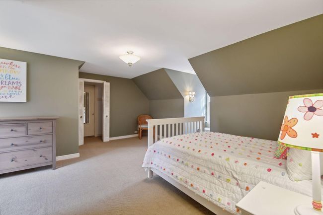 Second upper-level bedroom with access to bonus room via the closet. | Image 22