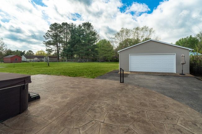 Patio with hot tub. Hot tub stays | Image 33
