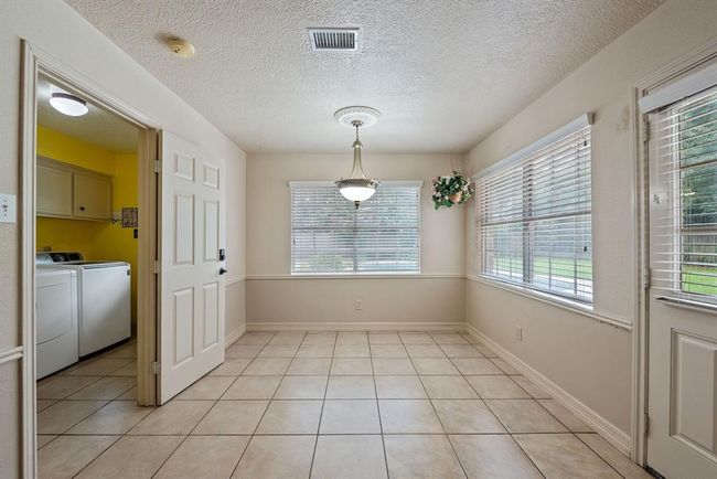 Breakfast room abounds with natural light and has direct access to the back yard. | Image 15