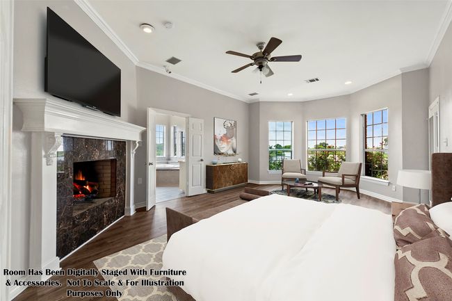 PRIMARY BEDROOM...Sitting Area, WB Fireplace, Door To Sunroom | Image 24