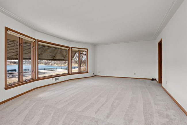 Huge Main Floor Living Room with bay window, Lake and Sunset views! | Image 17