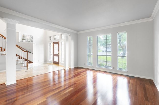 Empty room featuring plenty of natural light, stairway, ornate columns, and ornamental molding | Image 19