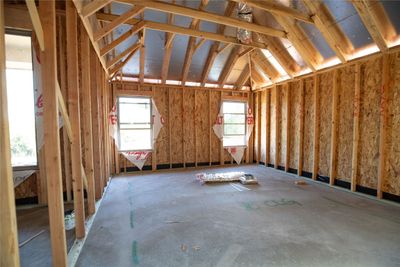 Miscellaneous room with lofted ceiling | Image 3