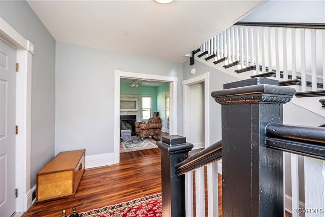 Living area featuring ceiling fan, plenty of natural light, and hardwood / wood-style flooring | Image 9
