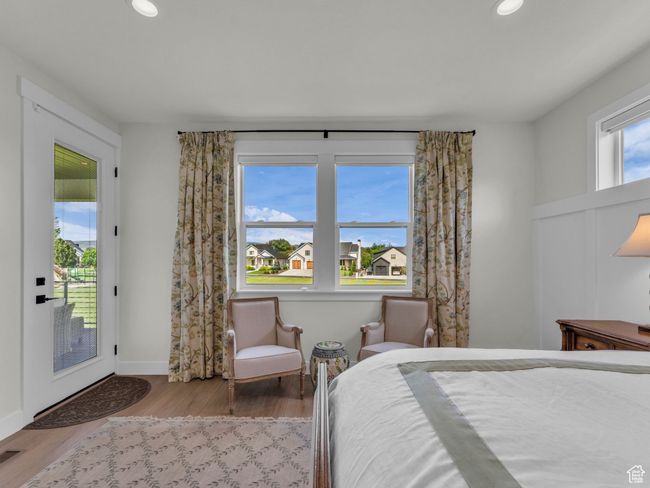 Bedroom with access to exterior, wood finished floors, recessed lighting, and baseboards | Image 22
