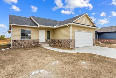 View of front facade with a garage | Image 1