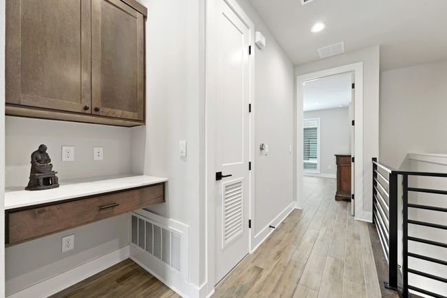Landing area on 3rd floor features nook that can be used for coffee, working space, or a decorative space. | Image 27