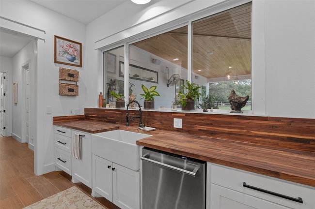 Kitchen overlooks patio and pool | Image 13