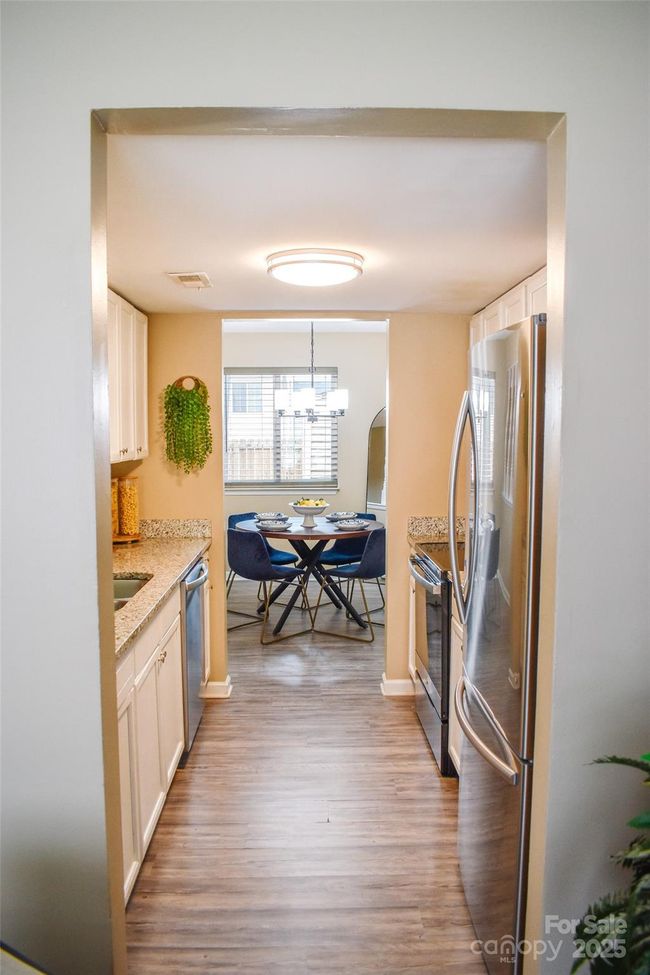Dining room is adjacent to the kitchen. | Image 9