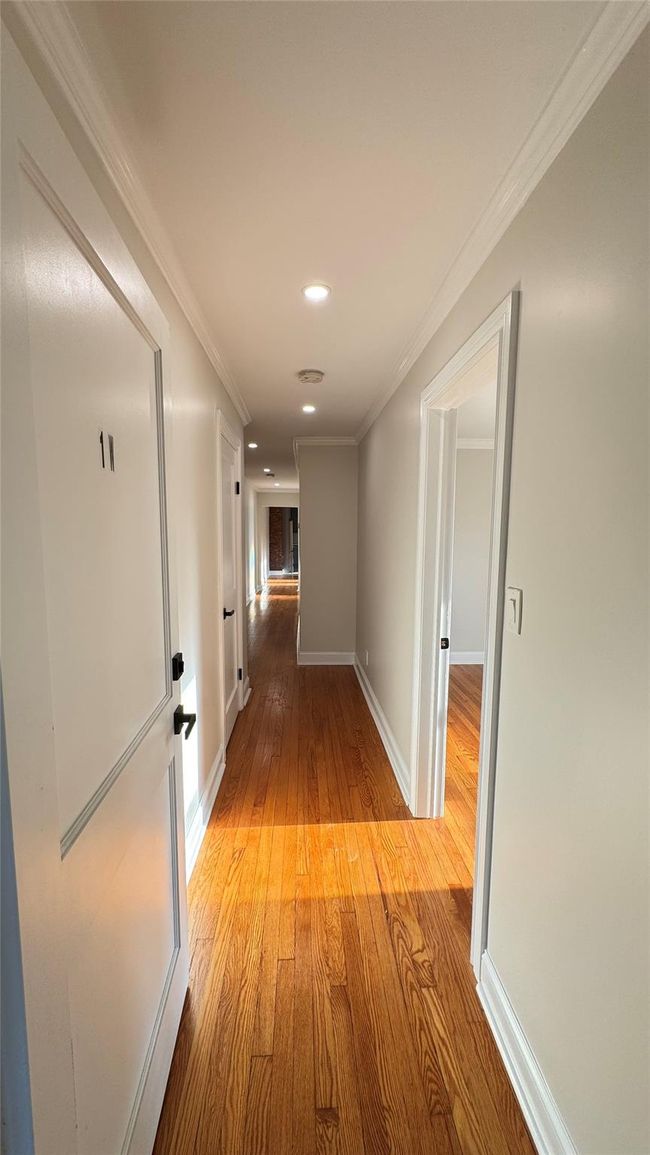 Hall with light wood-style flooring, recessed lighting, and ornamental molding | Image 11