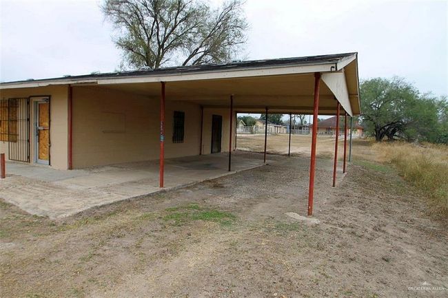 View of vehicle parking with a carport | Image 9
